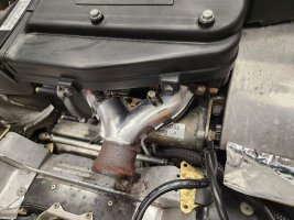 aluminum heatshields and fiberglass mat installed on exhaust header.jpg